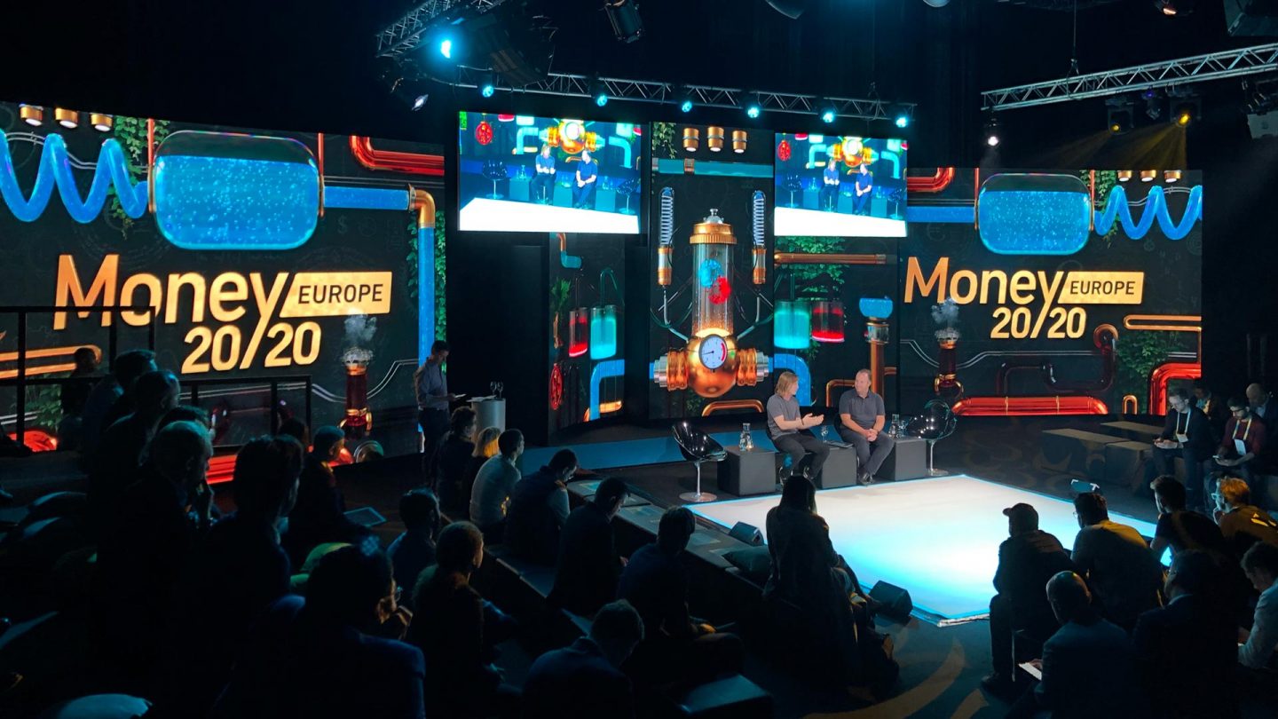 Money 20/20 Europe 2019 stage set up featuring alchemy graphics in the background