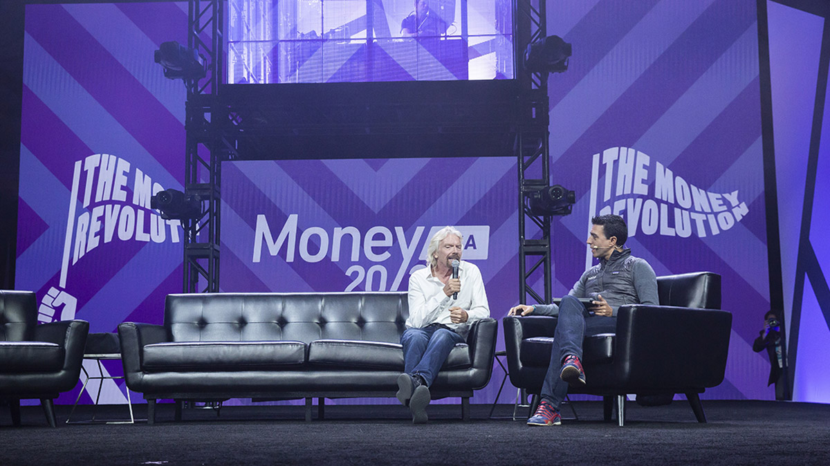 Money 2020 USA stage set up with speaker Richard Branson featuring screen graphics in the background